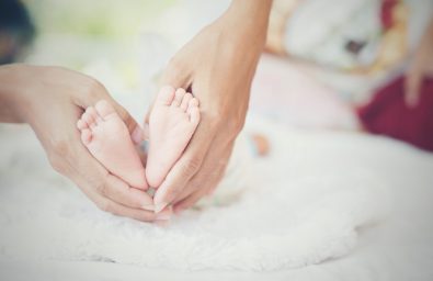 Newbron Baby feet in the mother hands. Newbron Baby feet in the mother hands.
